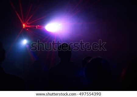 people having fun in a disco. blur effect