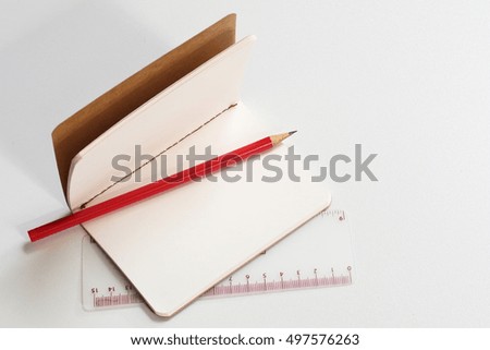 Paper note, ruler and pencil, free space for text.