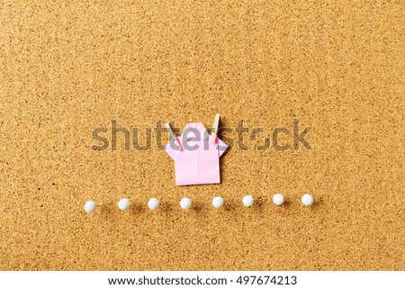 For beautiful background with cork board texture origami shirts and pins