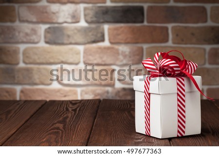 Christmas gift box on wooden table. View with copy space