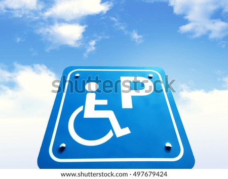 disable parking  road sign with a wheelchair  sky background