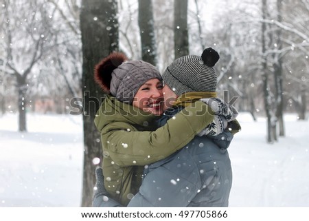 family couple walk winter snow