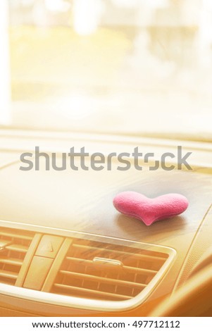 Inside the car with Pink heart with light filter