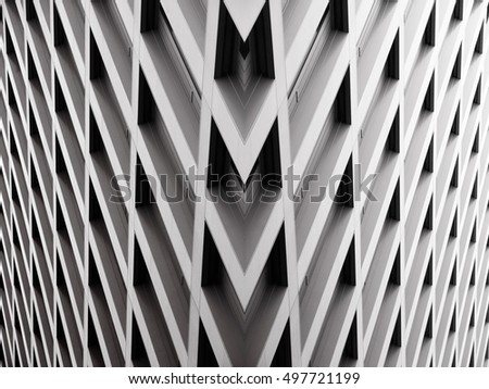 Modern office building with angular / rhombus structure of cells. Reworked abstract architecture photo. Royalty-Free Stock Photo #497721199