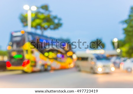 Blur image of big bus parking in gas station at twilight , use for background.