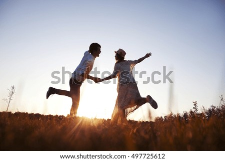 Young couple walking hand in hand