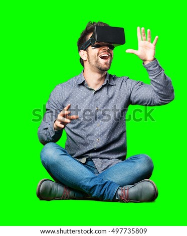 man sitting on the floor wearing a virtual reality glasses