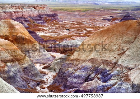 Striped purple sandstone formations of Blue Mesa badlands in Petrified Forest National Park, Arizona, USA Royalty-Free Stock Photo #497758987
