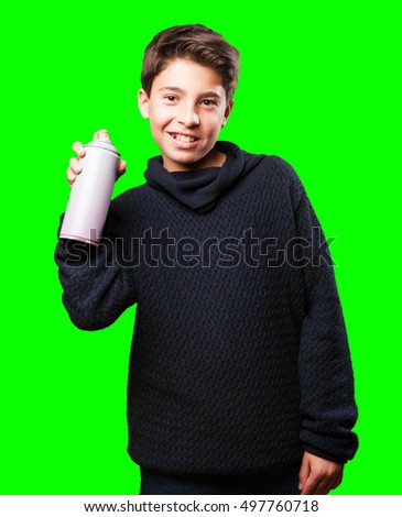 little boy holding a spray