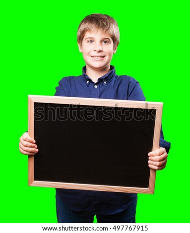little boy holding a blackboard