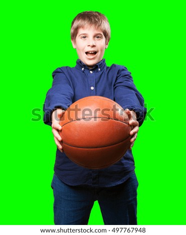 little boy holding a basket ball