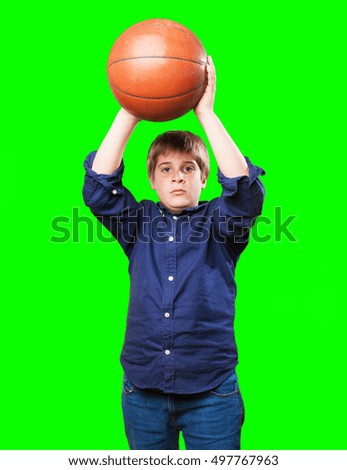 little boy holding a basket ball