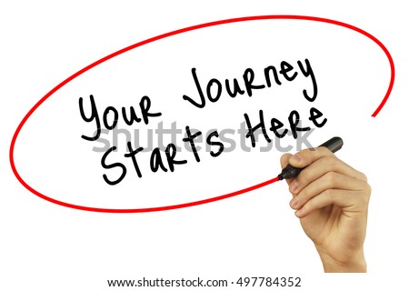 Man Hand writing Your Journey Starts Here with black marker on visual screen. Isolated on background. Business, technology, internet concept. Stock Photo