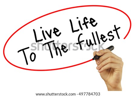 Man Hand writing Live Life To The Fullest with black marker on visual screen. Isolated on background. Business, technology, internet concept. Stock Photo