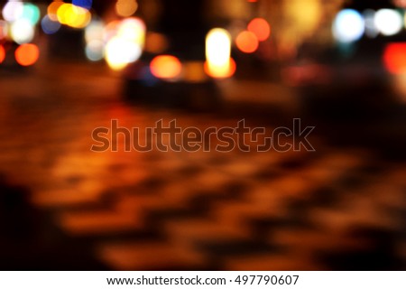 Blurred photo of night traffic in Paris center.
