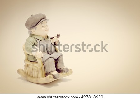 lovely grandparent doll siting rocking bamboo on white background.