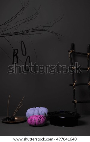 halloween pumpkins with bright colored tree and ladder on a dark background