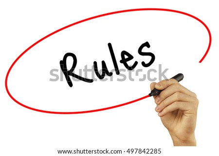 Man Hand writing Rules with black marker on visual screen. Isolated on background. Business, technology, internet concept. Stock Photo