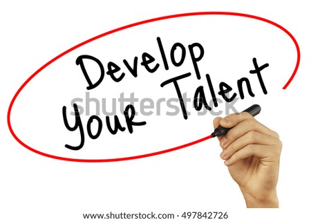 Man Hand writing Develop Your Talent with black marker on visual screen. Isolated on background. Business, technology, internet concept. Stock Photo