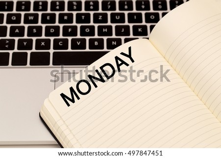 Word Monday on week planner page on laptop keyboard background,  close up