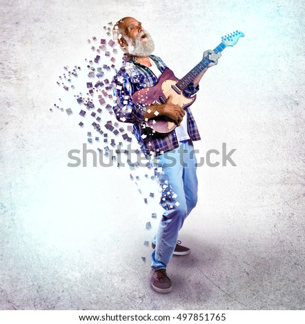 Elderly man playing guitar on light background. Creative music concept.