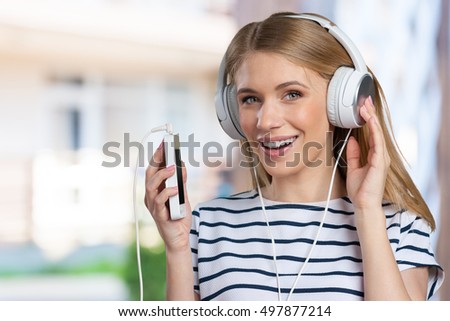 Woman with headphones listening music
