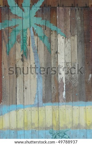 vintage palm on wooden background