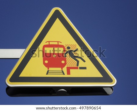 warning sign at train station
