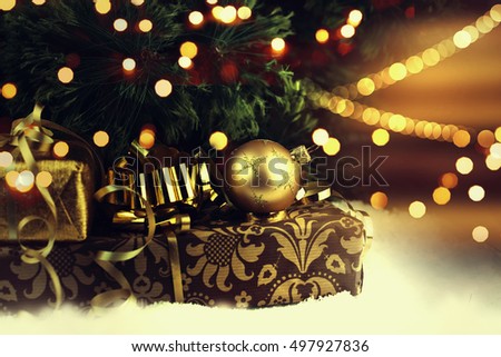Christmas gift boxes with decorations on light background.