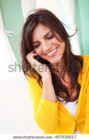 Portrait of a beautiful woman talking on the phone.