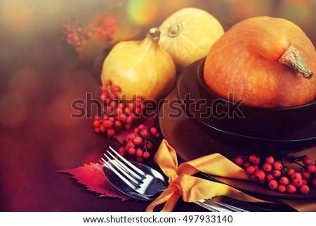 Autumn table setting with pumpkins. Thanksgiving dinner.