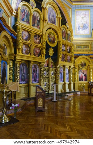Interior of the Christian church with painted walls and icons. The rich and beautiful decoration of churches. A place to serve. Ukraine.
