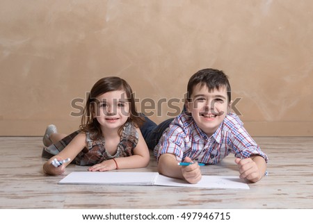 brother and sister drawing together