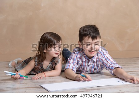 brother and sister drawing together