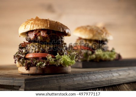 Close-up of home made burgers with potatoes, place for typography 
