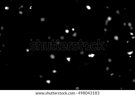 White blurred points bokeh on a black background