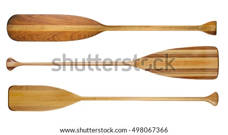 three traditional wooden canoe paddles with different shape of blades isolated on white Royalty-Free Stock Photo #498067366