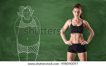 Sporty girl with a slim body standing at the right side and a picture of a fat woman drawn at the left side on a green chalkboard background. Getting rid of a pot belly. Losing weight. Before and