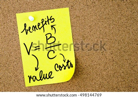 Value is Benefits per Costs text written on yellow paper note pinned on cork board with white thumbtack. Business concept image with copy space available
