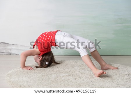 little girl doing yoga