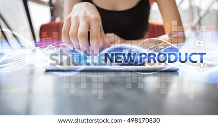 Woman is using tablet pc, pressing on virtual screen and selecting "New product".