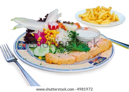 dinner of poached salmon with mixed salad and french fries isolated on white background
