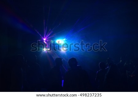 people having fun in a disco. blur effect