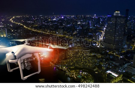 aerial view of using drone to take a photography of skyscraper at night 