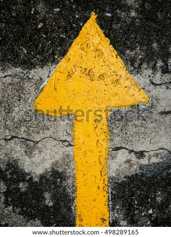traffic direction arrow on the road
