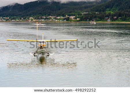 Sea plane landing in port in Juneau, Alaska