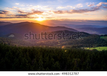 Colorful sunset in mountains. Photo was taken in Gorce mountains a part of Beskidy Mountains in Poland, View from Gorc peak,   Royalty-Free Stock Photo #498312787