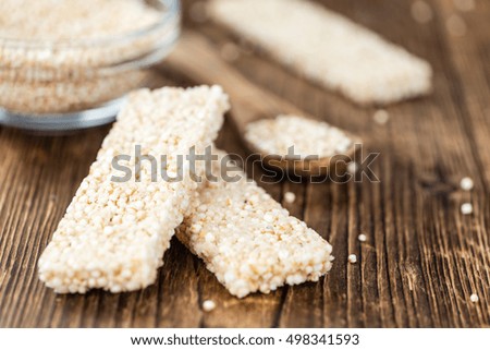 Portion of homemade Quinoa Bars (selective focus; close-up shot)