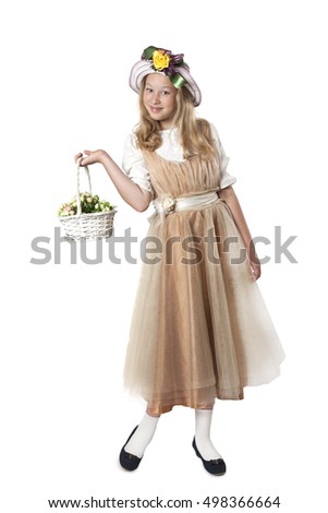 Little beautiful girl with long blonde hair holding a basket of flowers isolated on a white background

