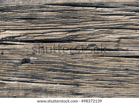 Old brown wood board surface texture. Close-up of damaged wooden floor background.